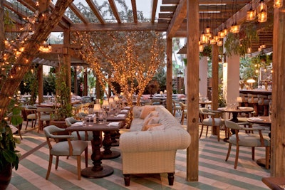Cecconi's is an outdoor restaurant decorated like a private garden, featuring a retractable roof to protect guests from rain.