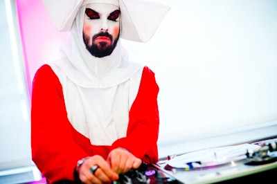 In July, MAC Cosmetics hosted a networking event for professional makeup artists at Milk Studios in Los Angeles. Inspired by cult punk band the Voluptuous Horror of Karen Black, models wore body paint with giant teased black wigs and DJ Spencer Sweeney spun in a nun getup.