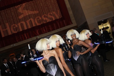 Moët Hennessy also used costumed girls to promote its Hennessy Black cognac. Staff in blond bob wigs carrying illuminated trays circled the room, distributing drinks to the crowd.