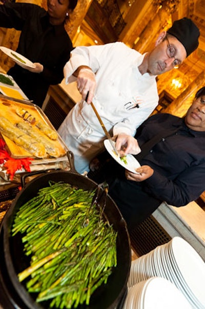 Gourmet Caterers provided food stations serving fresh vegetables and meat skewers.