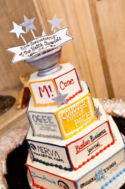 A four-tier anniversary cake by Cakes for Occasions highlighted event sponsors.