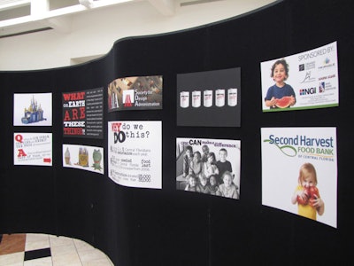 Information about Canstruction Orlando and hunger in Central Florida is part of the display at Orlando Fashion Square.