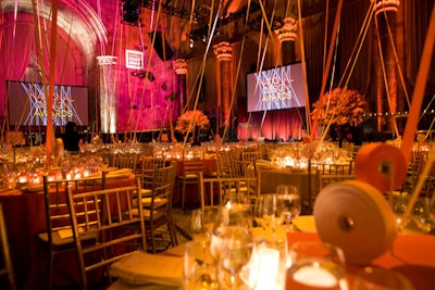 The fabric strips also became part of the tabletop design, with centerpieces serving as the point from which each roll of ribbon started.