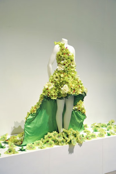 Designer Baby Steinberg created a green floral gown, which is on display at the venue and depicted in the creative materials for the event, including the guide book and Web site.