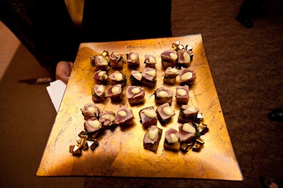 Servers used gold trays—dressed up with chunks of mock gold—to pass Jewell's hors d'oeuvres.