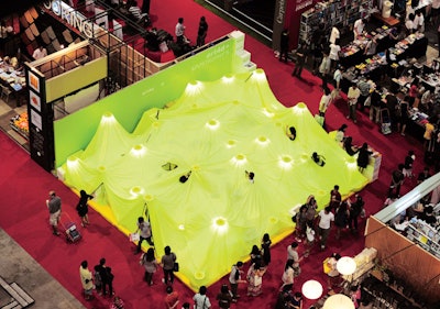 For Architect Expo 2010 in Bangkok, local design firm Apostrophy's, created a striking tented structure for publisher Art4d. The designers draped lime green fabric over several poles that lit the space from within. Huge black zippers served as windows and doors. Inside, the exhibit had five sections for reading, resting, drinking coffee, making purchases, and a play area for kids.