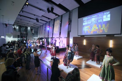 Instead of the typical runway show, models stood on a series of raised platforms, and guests were encouraged to walk the ballroom floor and see the collections up close and personal.