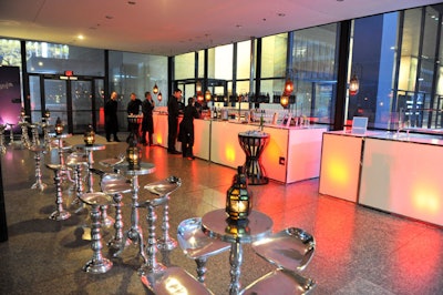 Moroccan-style lanterns topped metal cocktail tables throughout the reception area on the venue's main floor.