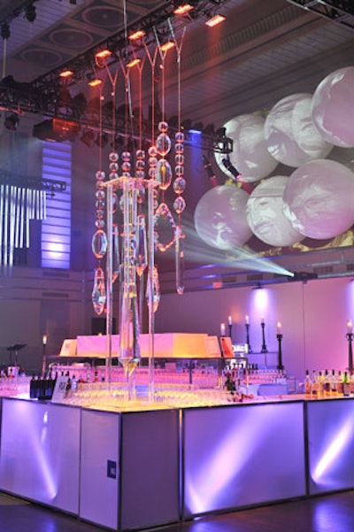 Iceculture designed a seven-piece chandelier, suspended from a truss line on 11-foot cables, for the centre of the main bar on the trading floor.