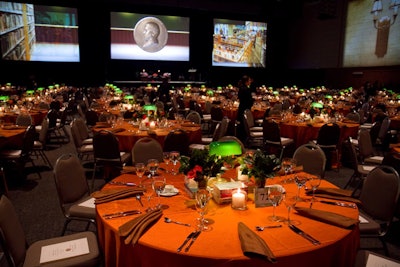 About 700 guests sat down for dinner at the Forum at the University of Illinois Chicago. Thematic touches included traditional library lamps on each table.
