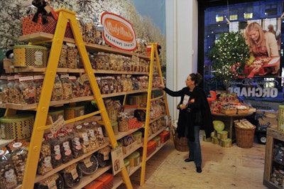 The Rockwell Group used ladders to create rustic-looking shelves for the pop-ups, which were used to display Harry & David's popular products like Moose Munch.