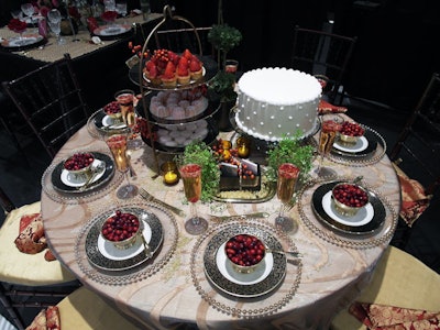 Glazier Group's 'Holiday Delights' had a Thanksgiving look, incorporating cranberries and harvest colors such as copper and bronze accents. An assortment of sweets served as a centerpiece.