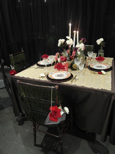 Private Receptions' 'Vintage Valentine' included small bouquets of pink and white flowers. Old-fashioned liquor bottles served as vases, and large red roses in champagne glasses topped pink patterned plates.