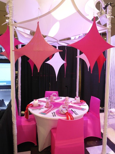 Pink Powered by Moss's tabletop had a Valentine's Day look, with pink and white scrims and colored candy arranged into patterns on the table's surface.
