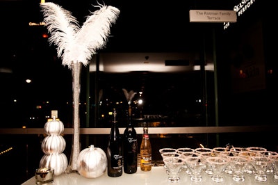 Silver pumpkins topped bars and catering stations throughout the venue.
