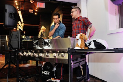 DJs Greg Ipp and Ian Worang spun tunes throughout the night at a Red Bull-branded Grill Chef barbecue turned DJ booth.