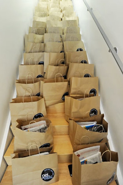 The event committee showcased gift bags on a staircase.