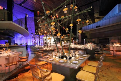 The eight square tables featured a 14-foot-tall bamboo centerpiece chosen to mimic the bamboo used throughout the Mead Center.