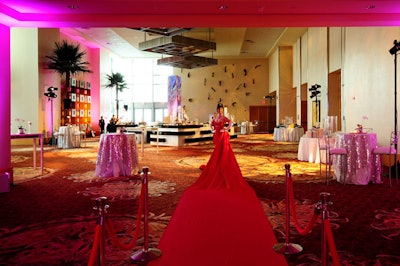 The Red Carpet Lady from the Champagne Creative Group in Las Vegas greeted guests as they walked into the cocktail reception area.