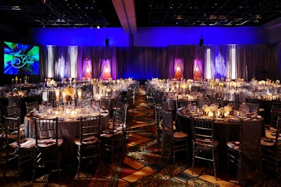 Custom lighting rigged into the ceiling lit up the tables' reflective surfaces.