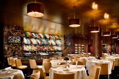 Called the M Bar, the central area at Mastro's has a reflective bottle display and serves specialty dry-ice martinis.