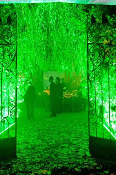Frank Alexander NYC gave the Central Park Conservancy's annual Halloween ball, held at Rumsey Playfield, an eerie, park-inspired look with an entry draped in branches and lit in green.