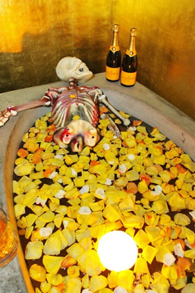 Staffers filled bathtubs with costumed models or fake skeletons and rose petals in the Champagne maker's signature yellow, at the Veuve Clicquot party.
