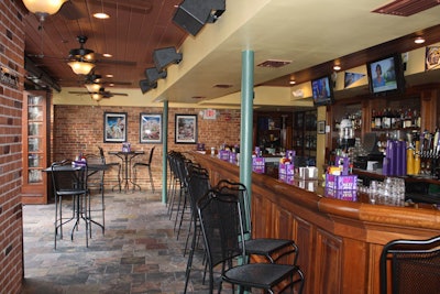 The bar in the front of the restaurant has seating for 24 and doors that open to the patio along Church Street.