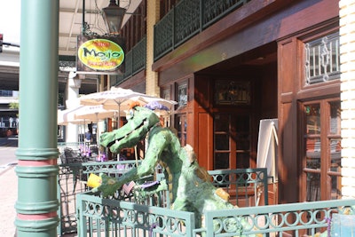 The restaurant's mascot, Tater the Cajun gator, greets guests at the entrance.