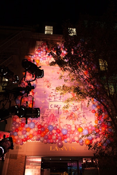 To dress the store's facade, Extra! Extra! attached hundreds of balloons from New York City Balloons to the six-story exterior and highlighted the whimsical decoration with floodlights.