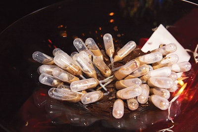 At the AIDS Foundation of Chicago's holiday-themed World of Chocolate event, guests sipped vanilla- and cinnamon-spiced hot chocolate from mini pipettes by the Signature Room at the 95th.