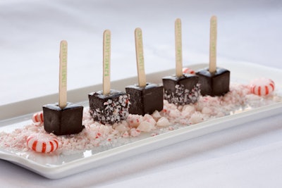 Chocolate sorbet popsicles on a bed of crushed peppermints from Limelight Catering in Chicago