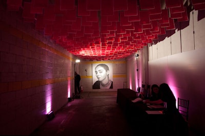 A portrait of the evening's honoree, Iranian visual artist Shirin Neshat, hung near the check-in station.