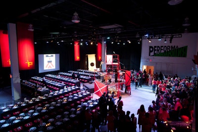 Performa filled Stage 37 with rows of long dining tables and a custom-built stage.