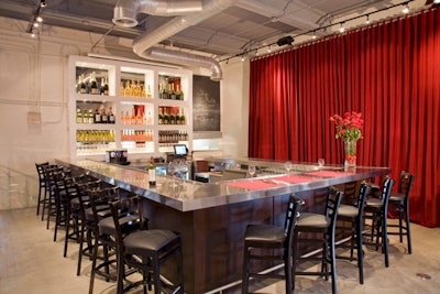 Wine Depot & Bistro 555's U-shaped bar to the left of the main entrance seats 18 for drinks and food.