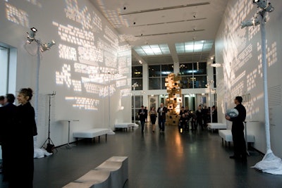 The evening began in the museum, where cardboard sculptures and patterned lighting mirrored the decor scheme in the dinner tent.