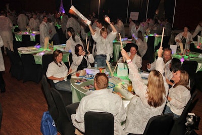 Throughout the event, guests banged drumsticks instead of clapping their hands to go along with the rock 'n' roll theme.