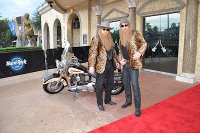 Celebrity look-alikes including Kiss, John Lennon, and ZZ Top greeted guests outside Hard Rock Live.