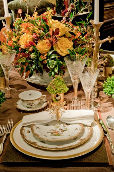 Designer Darlene Gentle of Turtle Bay Interiors created a nature-inspired tabletop using bird accents and yellow roses, plus antiques from the Barn at 17.