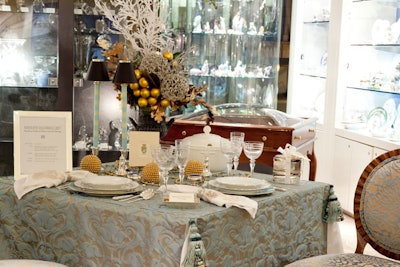 Kathleen Sullivan Elliott used blue, silver, and gold to create a holiday-chic table setting on Shreve's second floor, featuring sterling silver mint julep cups.