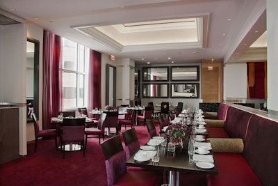 The 110-seat dining room at Michel Richard's new restaurant at the Ritz-Carlton Tysons Corner, Michel, is one of three spaces at the hotel available for group holiday events.