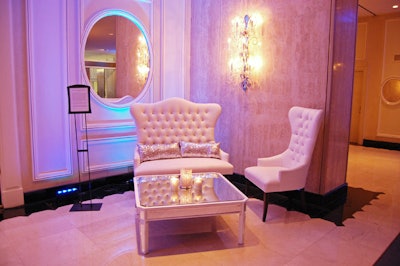 Event planner Mafalda Caruso used white furnishings with silver accents in the reception area.