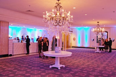 Rotating centrepieces, displayed on white tables set beneath two chandeliers, showcased the five short-listed books.