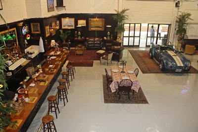 The walls around the bar and sitting area are paneled with dark wood to add warmth to the otherwise industrial space.