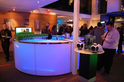 In keeping with the Tron theme, event organizers used neon lighting to highlight the circular bar, set up in the middle of the retail outlet.