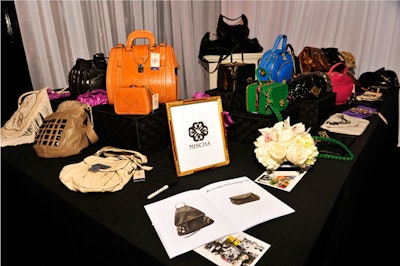 Mischa Barton displayed her new line of handbags.