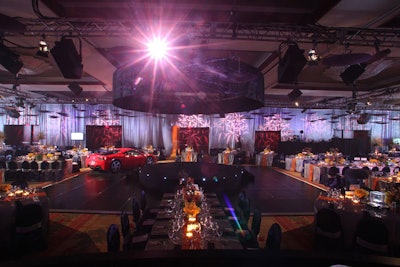 In contrast to the bright red and orange used on the mezzanine to symbolize ancient tradition, the motif for the ballroom was a modern city like Tokyo. Producer Javier Velarde used gobos, hanging umbrellas, and a palette of primarily blue, silver, and orange.