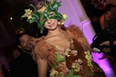 When designing the costumes, Birch drew inspiration from an Alexander McQueen collection that had hems and cuffs lined with feathers and flowers.