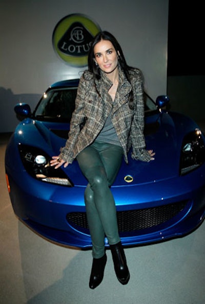 Guest Demi Moore posed on a Lotus vehicle.