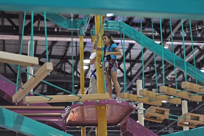 Ropes Courses Inc. built a 36-foot-tall adventure course with 16 elements, such as a balance beam, steps, and rope walk, on the expo floor.